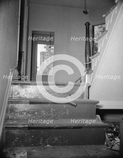 Interior of wrecked houses on Independence Avenue, Washington, D.C, 1942. Creator: Gordon Parks.