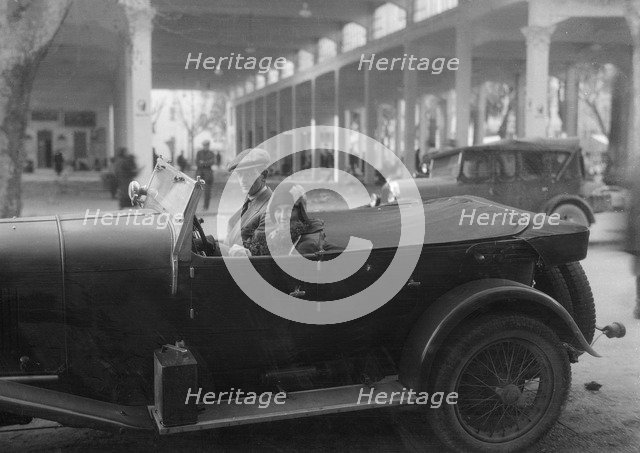 Lord de Clifford and Kitty Brunell in a Lagonda, San Remo, Italy, c1930(?). Artist: Bill Brunell.