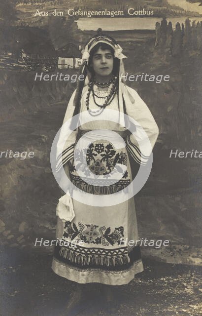A Ukrainian prisoner of war performing a dance at a prisoner... (between 1910 and 1919?). Creator: Paul Tharan.
