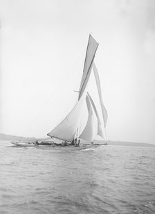 The 40-rater cutter 'Carina' sailing on a reach, 1911. Creator: Kirk & Sons of Cowes.