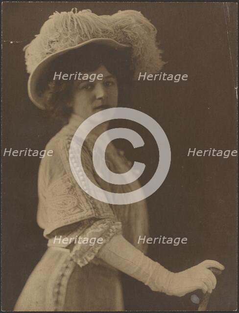 Portrait of a Woman Standing with Umbrella, 1907-1943. Creator: Louis Fleckenstein.