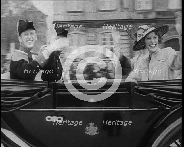 Well Dressed Men and Women Riding in a Car, 1930s. Creator: British Pathe Ltd.