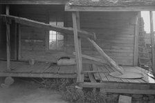 Porch of a sharecropper's cabin, Hale County, Alabama, 1936. Creator: Walker Evans.
