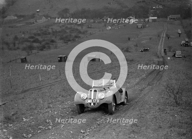 Frazer-Nash BMW 328 of H Wood at the London Motor Club Coventry Cup Trial, Knatts Hill, Kent, 1938. Artist: Bill Brunell.