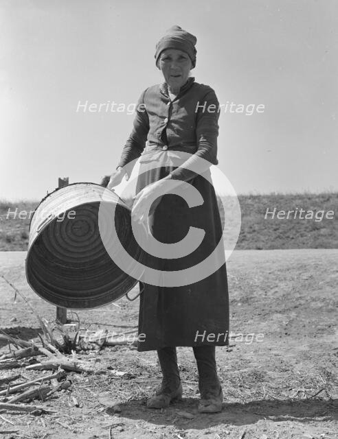 A grandmother in a contractor's camp, Stanislaus County, California, 1939. Creator: Dorothea Lange.