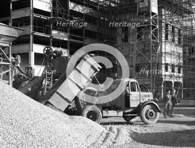 Early 1950s Bedford M Tipper delivering aggregates to a building site, South Yorkshire, July 1954. Artist: Michael Walters