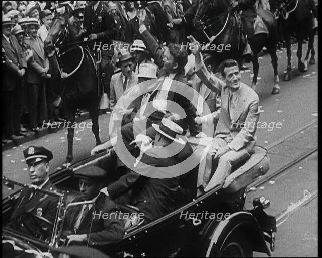 Wiley Post Sitting in a Car with Other Men, 1933. Creator: British Pathe Ltd.