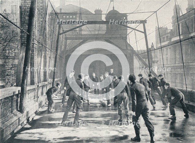 Boys playing football on the roof of St Paul's Cathedral Choir School, London, c1901 (1901). Artist: Unknown.
