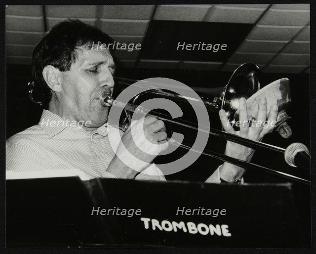 Trombonist Derek Wadsworth playing at The Fairway, Welwyn Garden City, Hertfordshire, 28 July 1991. Artist: Denis Williams