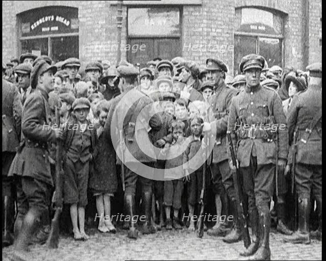 Soldiers Holding Back Children in Dublin, 1922. Creator: British Pathe Ltd.