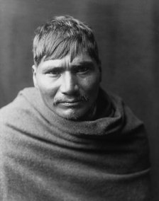 Yaqui man, head-and-shoulders portrait, facing front, c1907. Creator: Edward Sheriff Curtis.