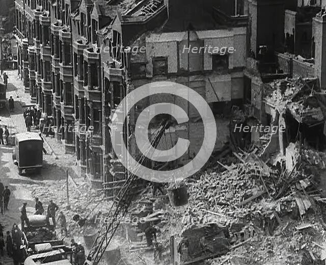 People Clearing Out Bomb Damage , 1942. Creator: British Pathe Ltd.