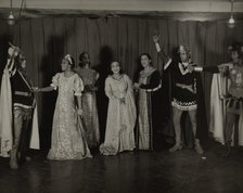 Parker Watkins with raised sword, and others, 1936. Creator: Eagle Ezzes & Mipaas.
