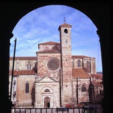 Exterior view of the Cathedral of Siguenza through an arc.