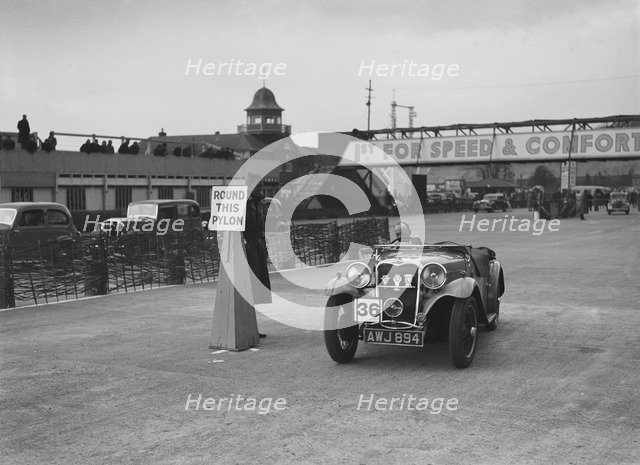 Singer sports competing in the JCC Rally, Brooklands, Surrey, 1939. Artist: Bill Brunell.