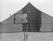 Revival meetings are held in Yakima shacktown, Sumac Park, Yakima, Washington, 1939. Creator: Dorothea Lange.