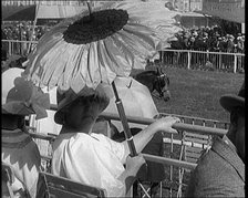 A Female Civilian Emerging from Behind a Sun Flower Shaped Parasol, 1920. Creator: British Pathe Ltd.
