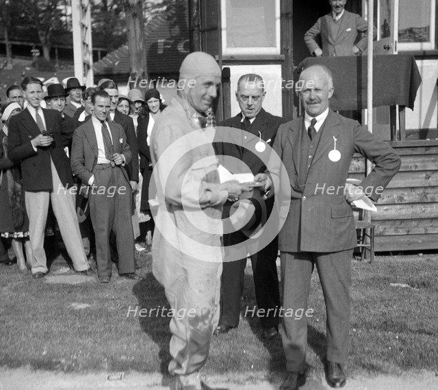 Earl Howe at the BARC Meeting, Brooklands, 25 May 1931. Artist: Bill Brunell.