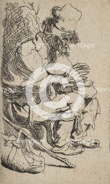 Beggar Seated Warming His Hands at a Chafing Dish, ca. 1630., ca. 1630. Creator: Rembrandt Harmensz van Rijn.