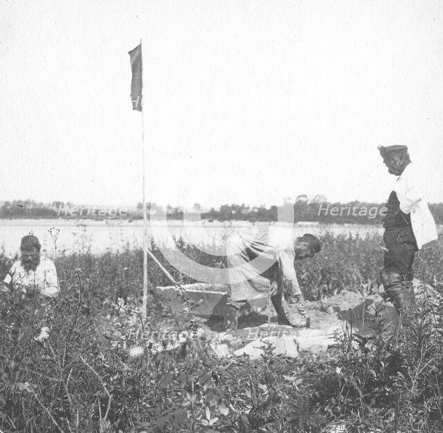 The moment of laying the benchmark on the river bank, 1909. Creator: Vladimir Ivanovich Fedorov.