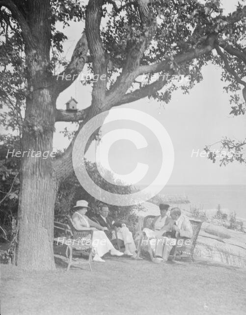 Cosgrave group seated outdoors, 1917 Creator: Arnold Genthe.