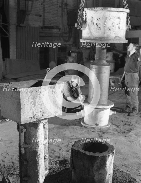 Stripping a steel casting, Wombwell Foundry, South Yorkshire, 1963.  Artist: Michael Walters