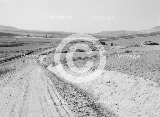 Entering Cow Hollow region in which practically all are FSA borrowers, Malheur County, Oregon, 1939. Creator: Dorothea Lange.