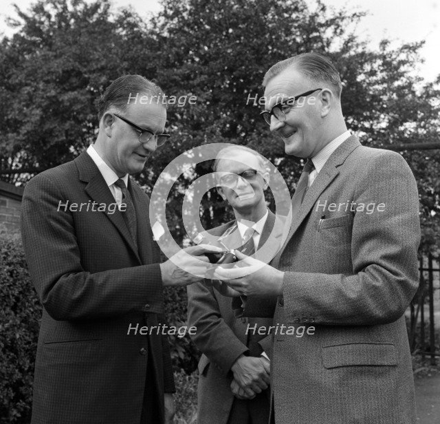Dr Lowe of ICI being presented with a camera, Denaby Main, South Yorkshire, 1962.  Artist: Michael Walters