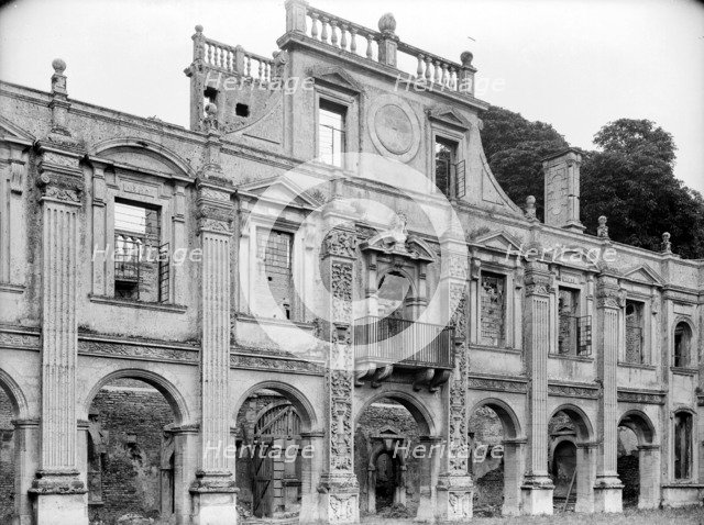 Empty shell of the north side of inner courtyard at Kirby Hall, Gretton, Northamptonshire, 1925.   Artist: Nathaniel Lloyd