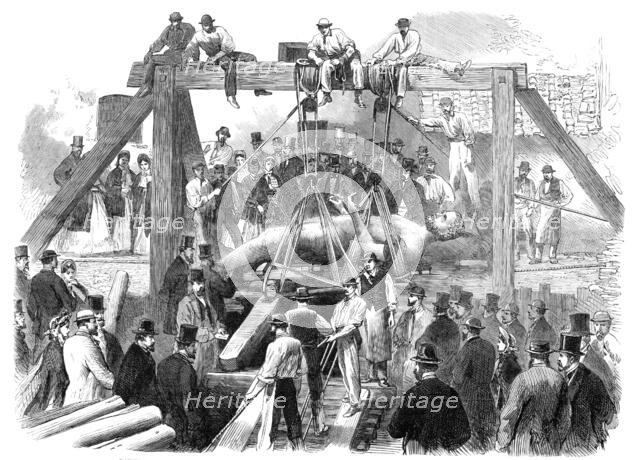 Raising the colossal bronze statue of Hercules found underground in the Campo dei Fiori, Rome, 1864. Creator: Unknown.