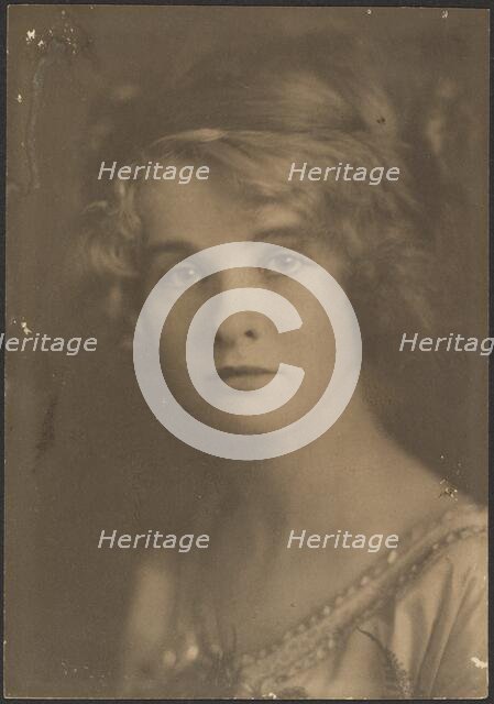 Portrait of a Woman Holding Bouquet with Fern, 1907-1924. Creator: Louis Fleckenstein.