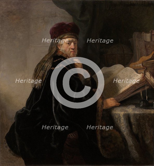 A Scholar Seated at a Desk (Scholar at his Study). Artist: Rembrandt van Rhijn (1606-1669)