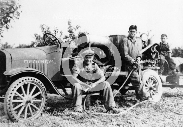 Farmworkers with a tractor, (c1930s?). Artist: Unknown