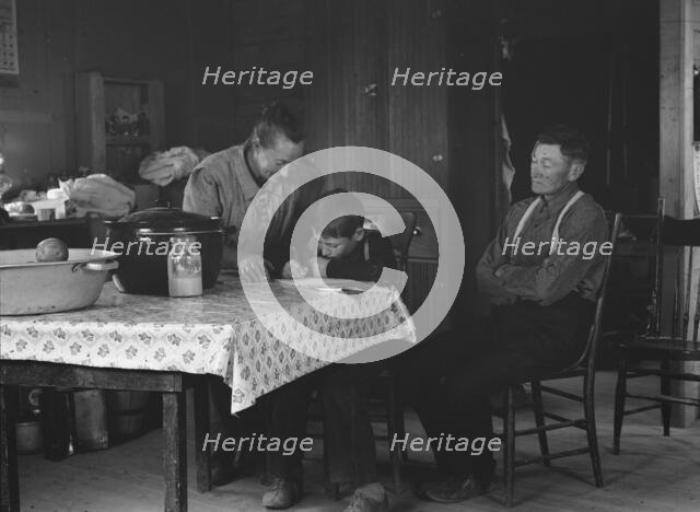 The Wardlow family in their dugout basement home on Sunday, Dead Ox Flat, Oregon, 1939. Creator: Dorothea Lange.