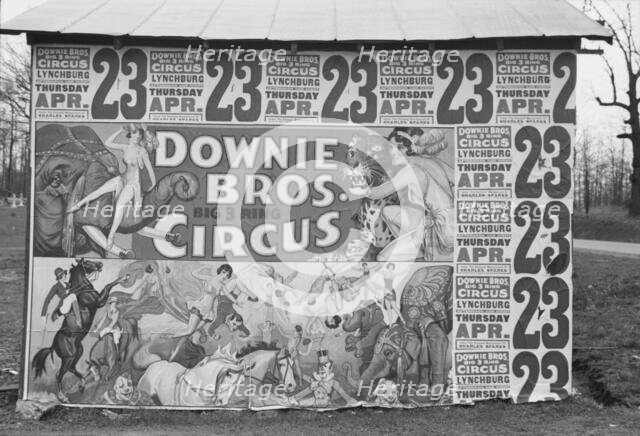 Posters covering a building near Lynchburg to advertise a Downie Bros. circus, 1936. Creator: Walker Evans.