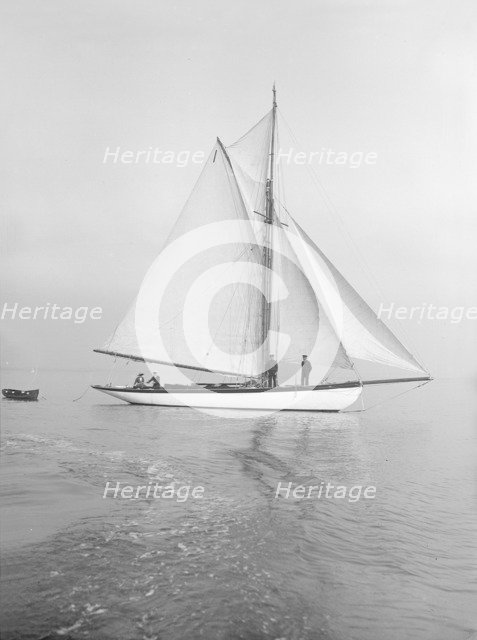 The cutter 'Wenda' in light winds, 1912. Creator: Kirk & Sons of Cowes.