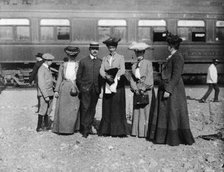 Group of people posed with railroad car behind them, Denver, Colorado, (1903?). Creator: Frances Benjamin Johnston.