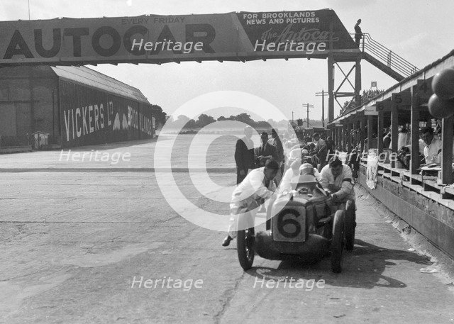 'Rubber Duck', works Austin 7 of Charles Goodacre in the pits, BRDC 500 Mile Race, Brooklands, 1931. Artist: Bill Brunell.
