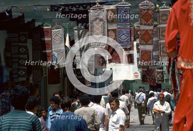 Carpets in the souk in Kairouan. Artist: Unknown
