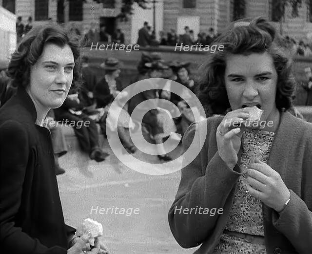 Two Women Eating in Trafalgar Square, 1940. Creator: British Pathe Ltd.