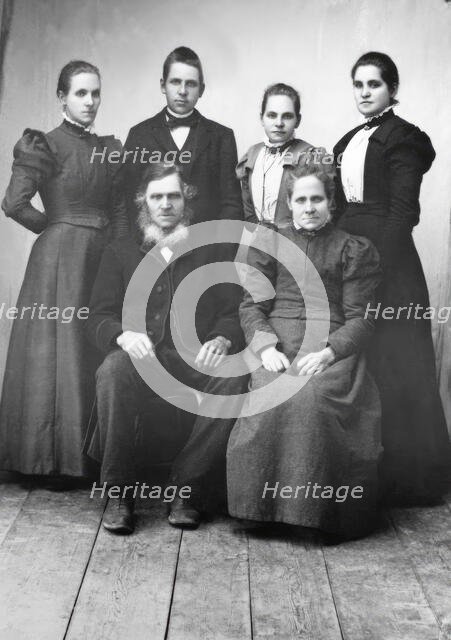 Studio portrait: "Sitting: Lispa Per, Karin Eriksson Standing from left Anna, Edvard..., 1890-1900. Creator: Lars Olsson Akerman.