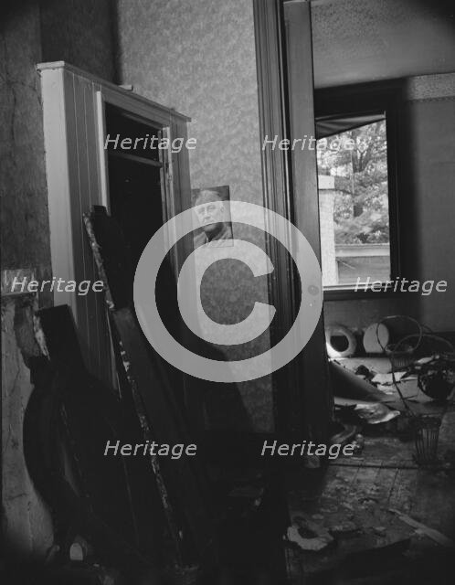 Interior of house being wrecked on Independence Avenue, Washington, D.C, 1942. Creator: Gordon Parks.