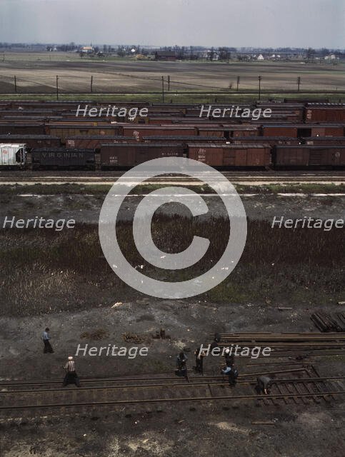 Section crew at work on the track, C. M. St. P. & P. R.R., Bensenville, Ill., 1943. Creator: Jack Delano.