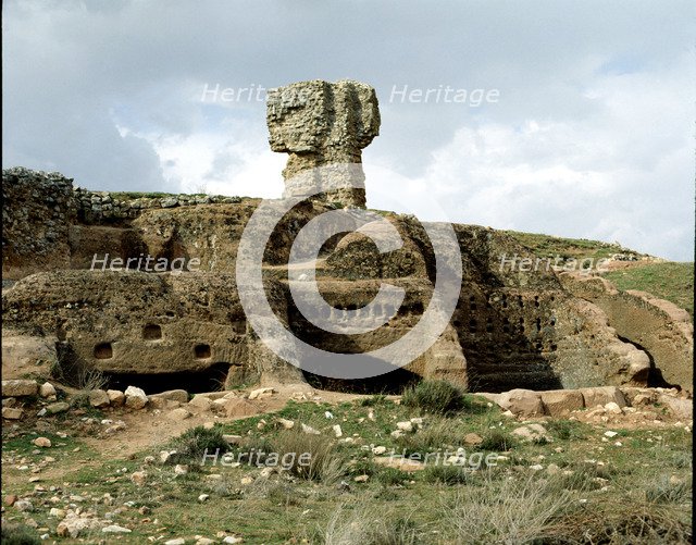 Celtiberian Roman rock city of Tiermes, detail of the rock digged houses, with the Roman baths at…