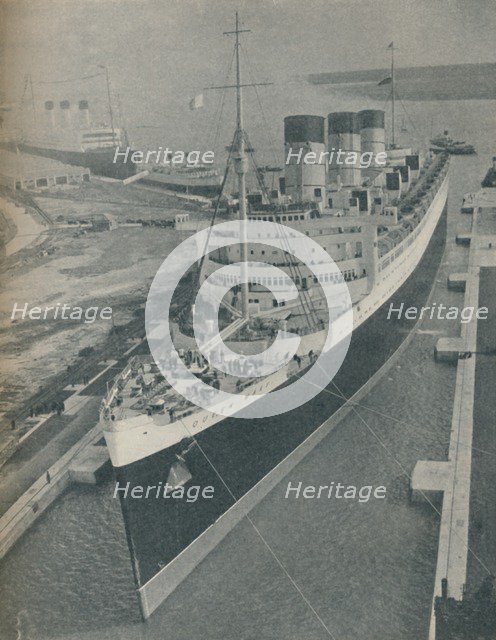 'Arrival of RMS Cunard White Star liner Queen Mary in King George V Graving Dock', 1936. Artist: Unknown.