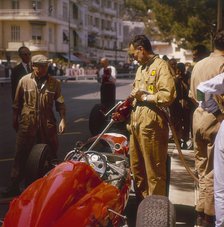 A Ferrari team member filling a car with fuel, Monaco Grand Prix, Monte Carlo, 1963. Artist: Unknown