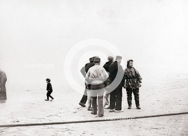 Men on the shore, Scheveningen, Netherlands, 1898.Artist: James Batkin