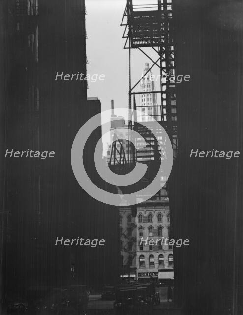 View between buildings of Mather Building/Tower in distance. Chicago, Illinois, c1896-c1942. Creator: Arnold Genthe.