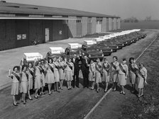 Australian sales girls in front of a fleet of 1965 Hillman Imps, Selby, North Yorkshire, 1965. Artist: Michael Walters