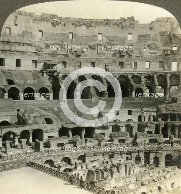 'Stupendous interior of the Colosseum, with dens of wild beasts, Rome', c1909. Creator: Unknown.